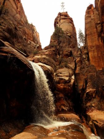 Waterfall between tall rocks