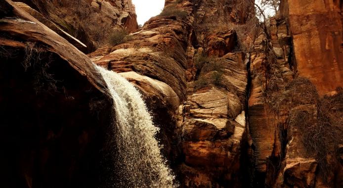 Waterfall between tall rocks